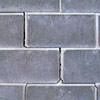 A diagonal stair-step crack found along a foundation wall in a  home