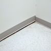 A partition wall separating from the floor in a  home.