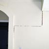 partition walls being pulled away from the foundation walls in a  home.