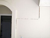 Drywall cracking due to foundation settlement in 