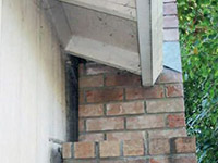 A chimney leaning away from the home on a  foundation
