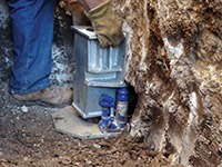 Securing a foundation footing bracket for a foundation repair system in .