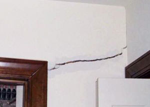 A large drywall crack in an interior wall in Kauai