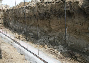 Soil layers exposed while excavating to construct a new foundation in 